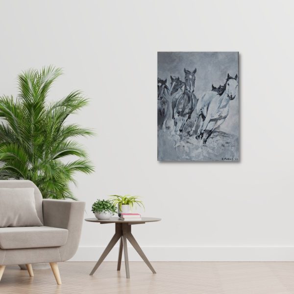 "Wild Horses" on a wall next to a fern and an armchair