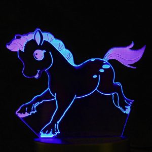 A laser cut design of a cartoon pony, illuminated in purple