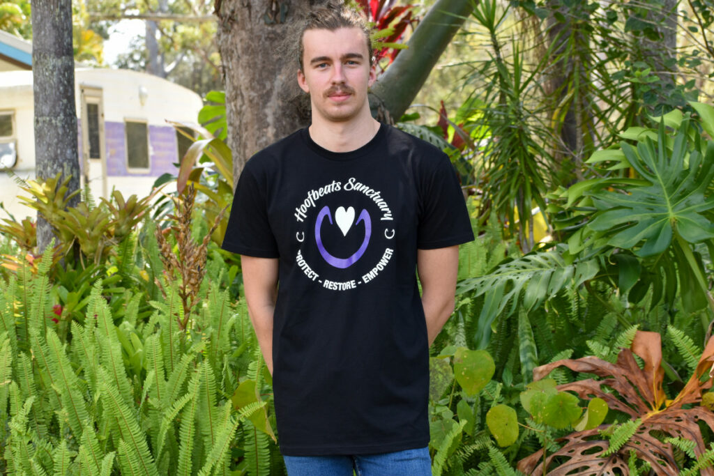 A model wearing one of our black coloured Hoofbeats mens t-shirts