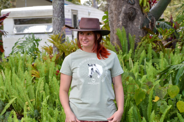 A model wearing one of our avocado green coloured Hoofbeats womens t-shirts