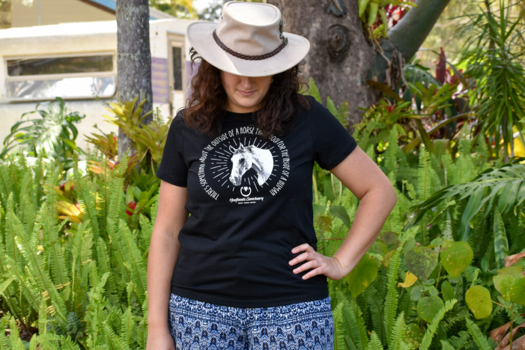 A model wearing one of our black coloured Hoofbeats womens t-shirts
