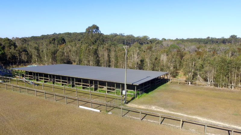 An aerial view of a stable block and surrounding paddocks