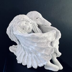 'Feathered Friends' by Donna Fisher, a sculpture of a woman being embraced by a winged bird